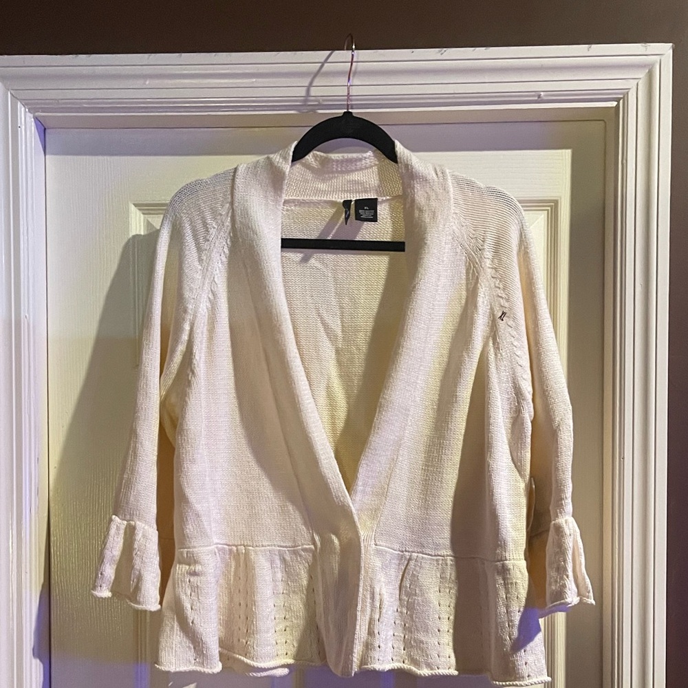 Cream colored knit sweater.